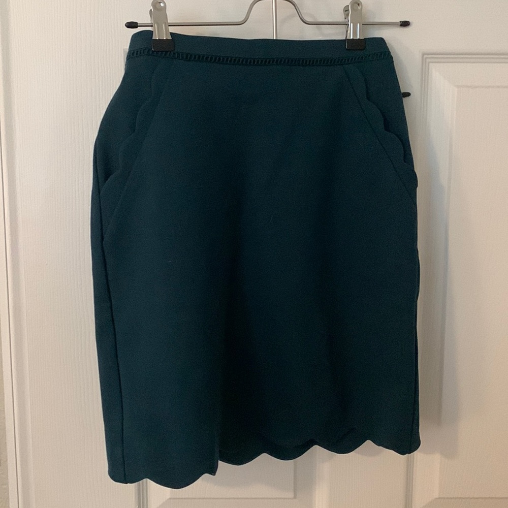Skies are blue, teal, high waisted skirt, scallop detailing